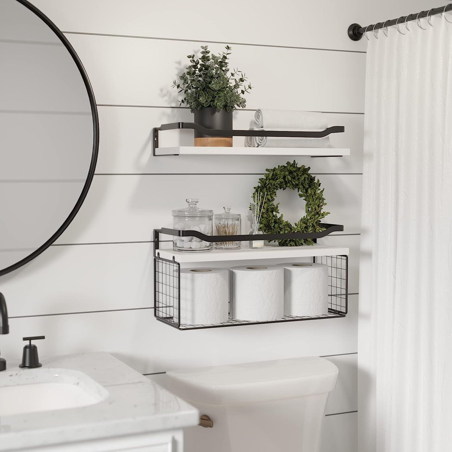 Bathroom wall decor featuring white shiplap walls and black industrial shelves
