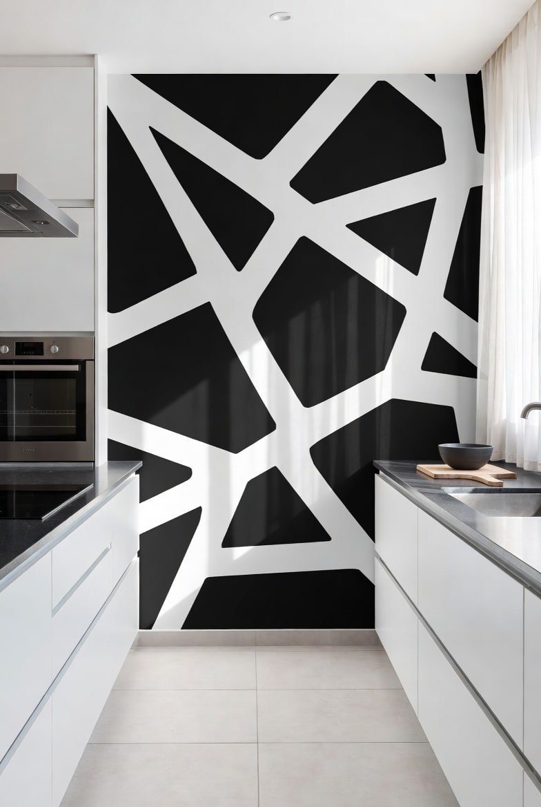 Kitchen featuring a black and white abstract geometric pattern accent wall