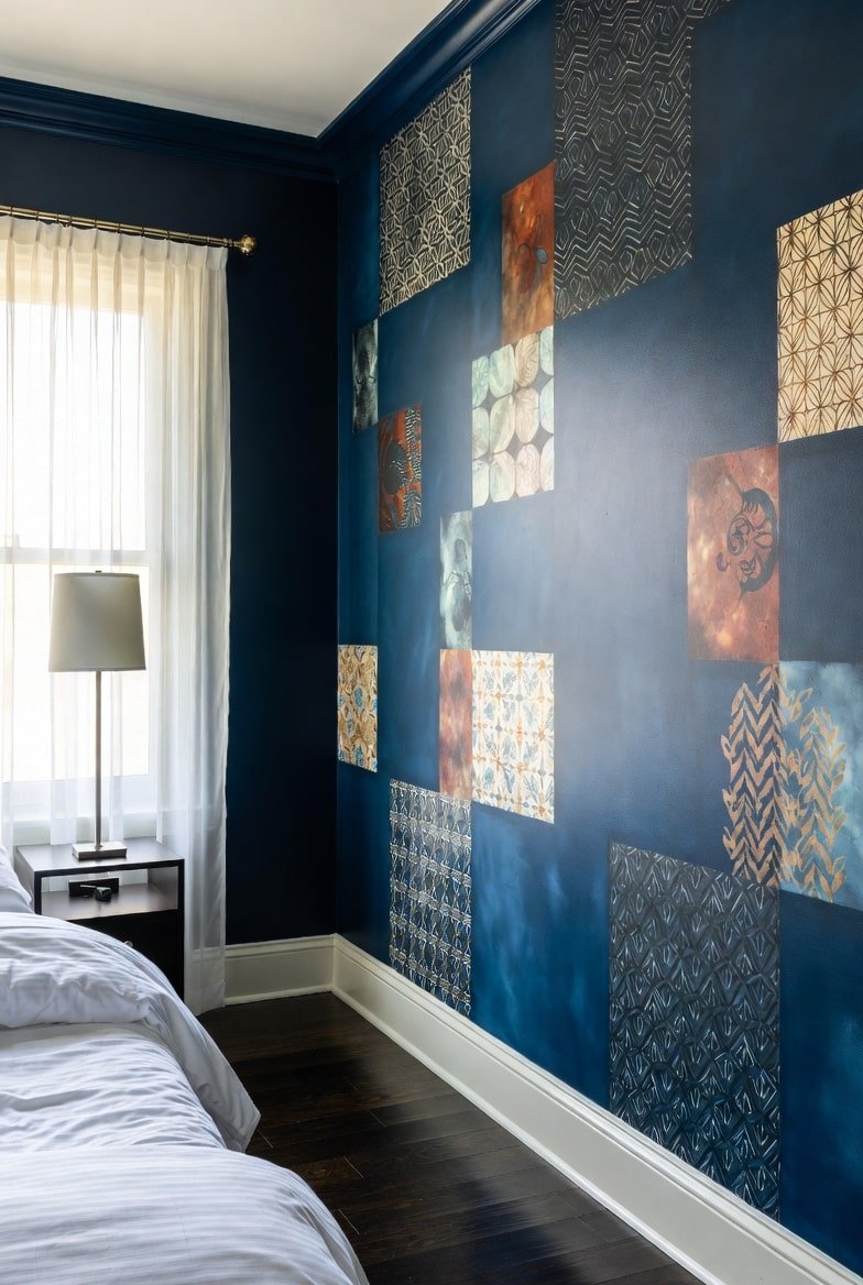Navy blue accent wall featuring scattered metallic and patterned square tiles