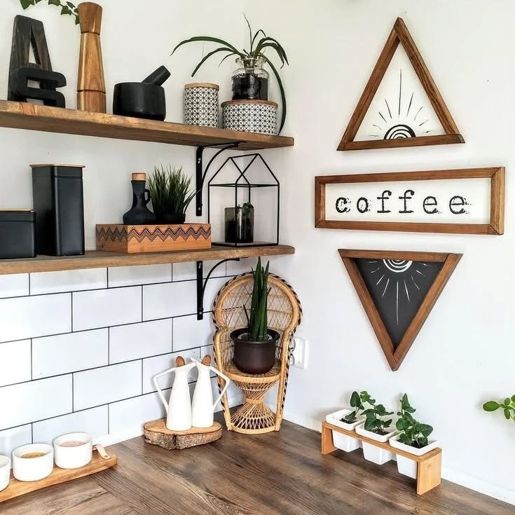 Kitchen wall featuring triangular wooden art frames with sun motifs and a coffee sign