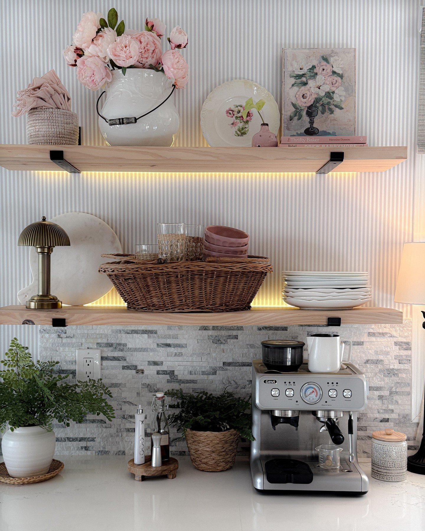 Kitchen open shelving with vertical striped wallpaper and under-shelf LED lighting