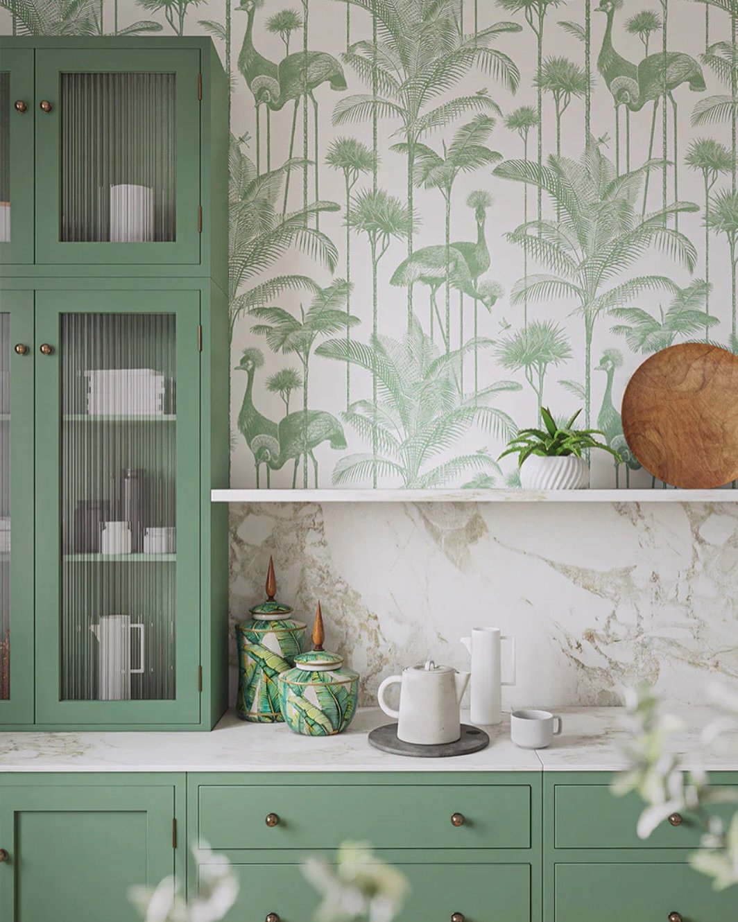 Kitchen featuring green crane and palm tree wallpaper above marble backsplash
