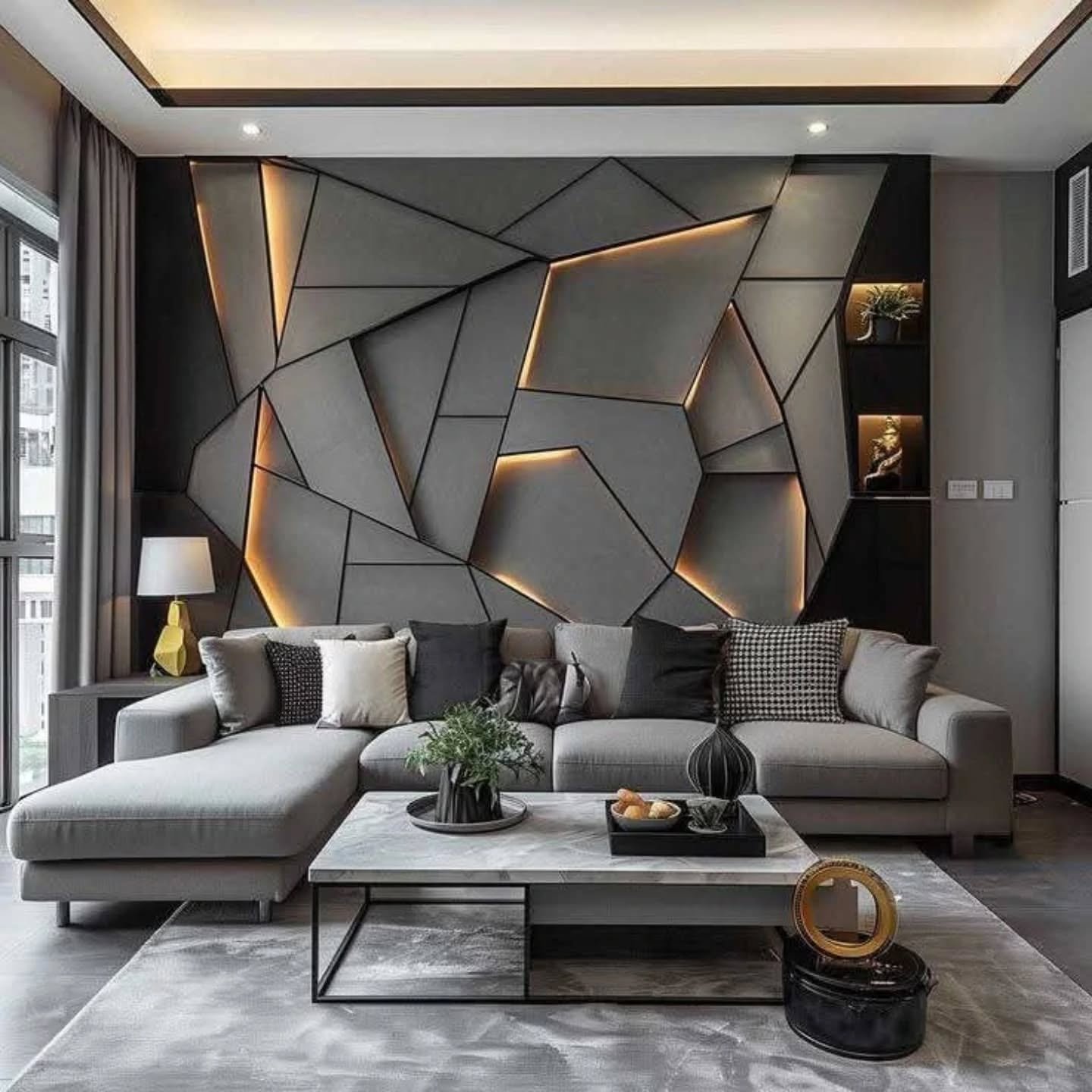 Dark grey living room wall featuring 3D geometric panels with warm LED backlighting behind a grey sectional.