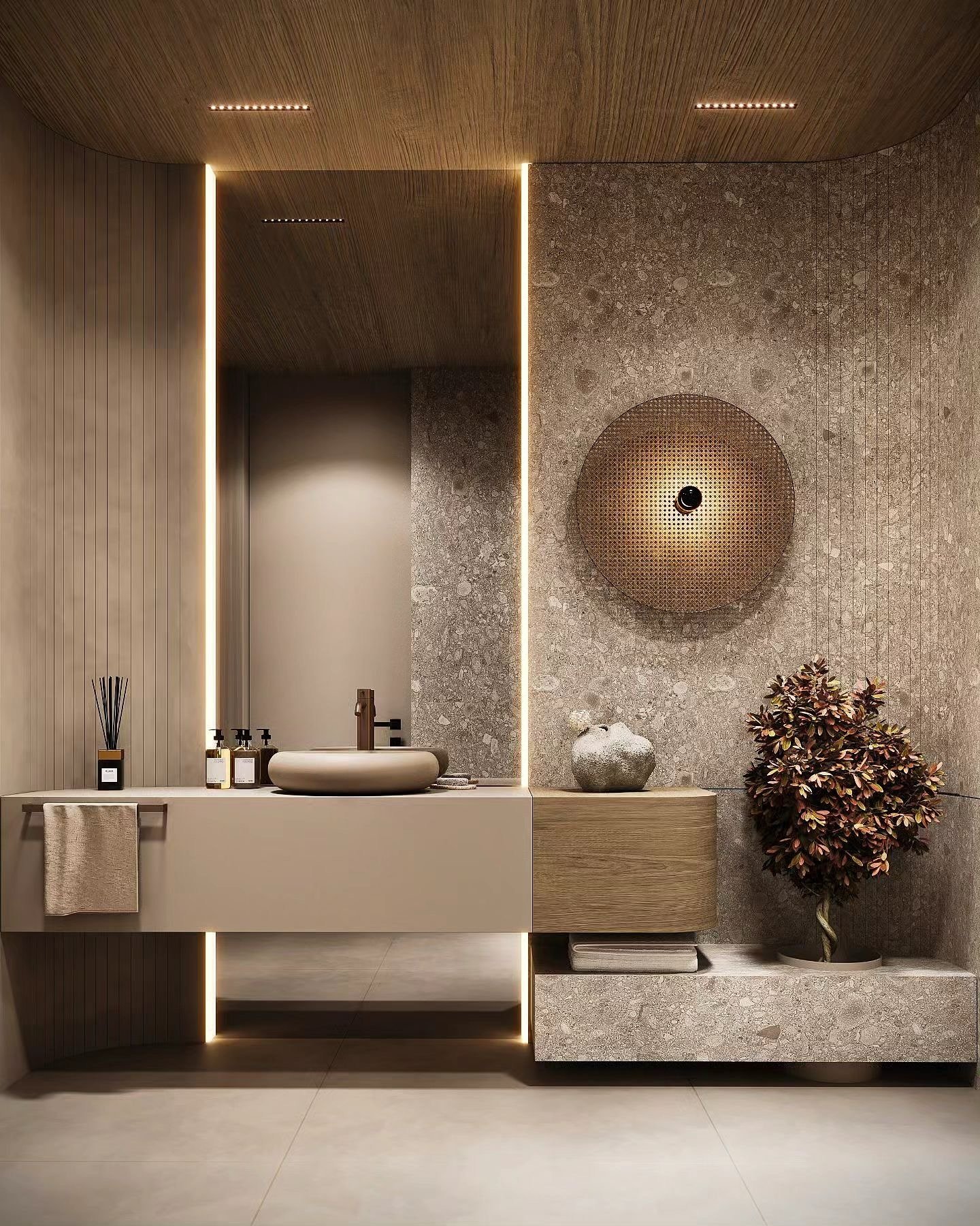 Gray stone accent wall in bathroom featuring round woven sconce and vertical LED strips