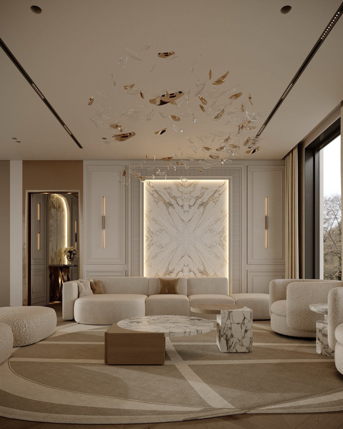 Luxury beige living room featuring a backlit book-matched marble accent wall framed by sleek vertical sconces and an artistic gold ceiling fixture.