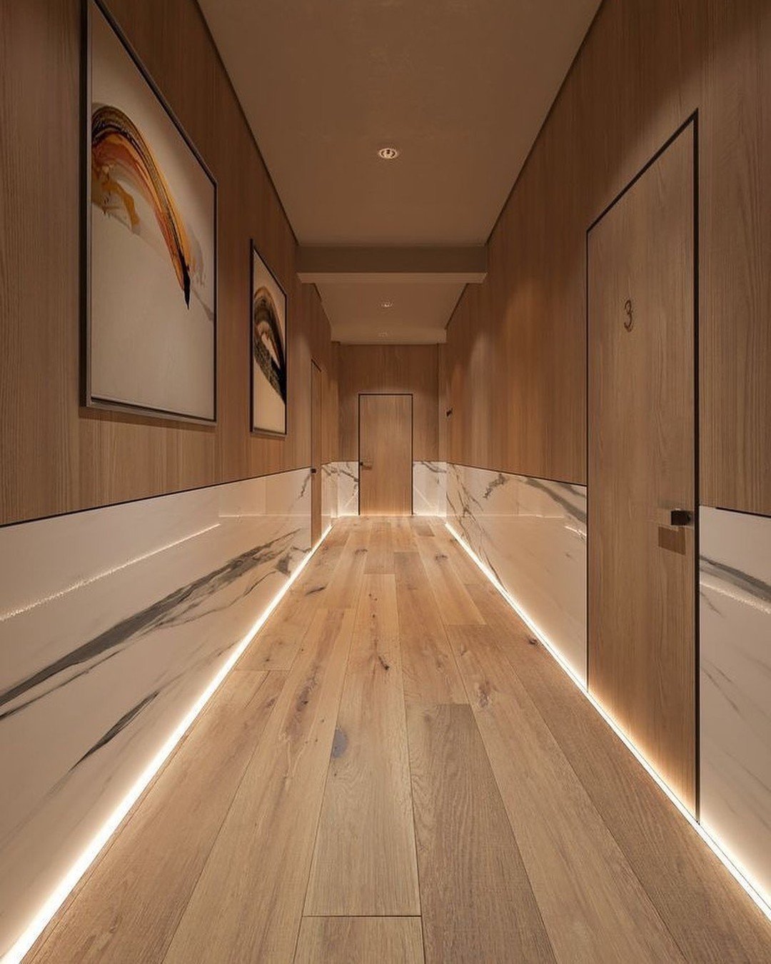 Hallway featuring wood paneling on top and white marble wainscoting below separated by an LED strip.