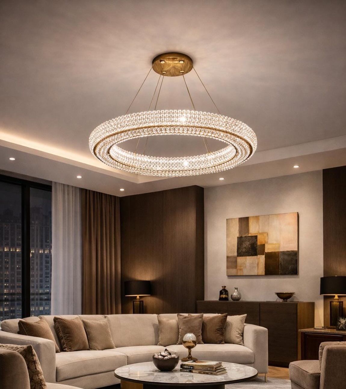 Elegant modern living room with a suspended double-ring crystal chandelier above a beige sofa and dark wood walls.