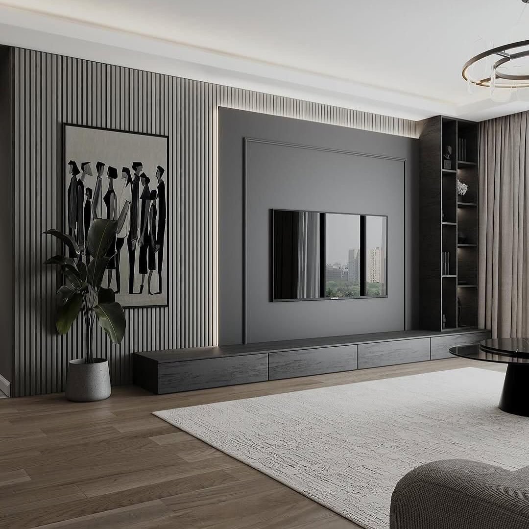 Dark grey fluted TV wall with framed central panel and black abstract art.