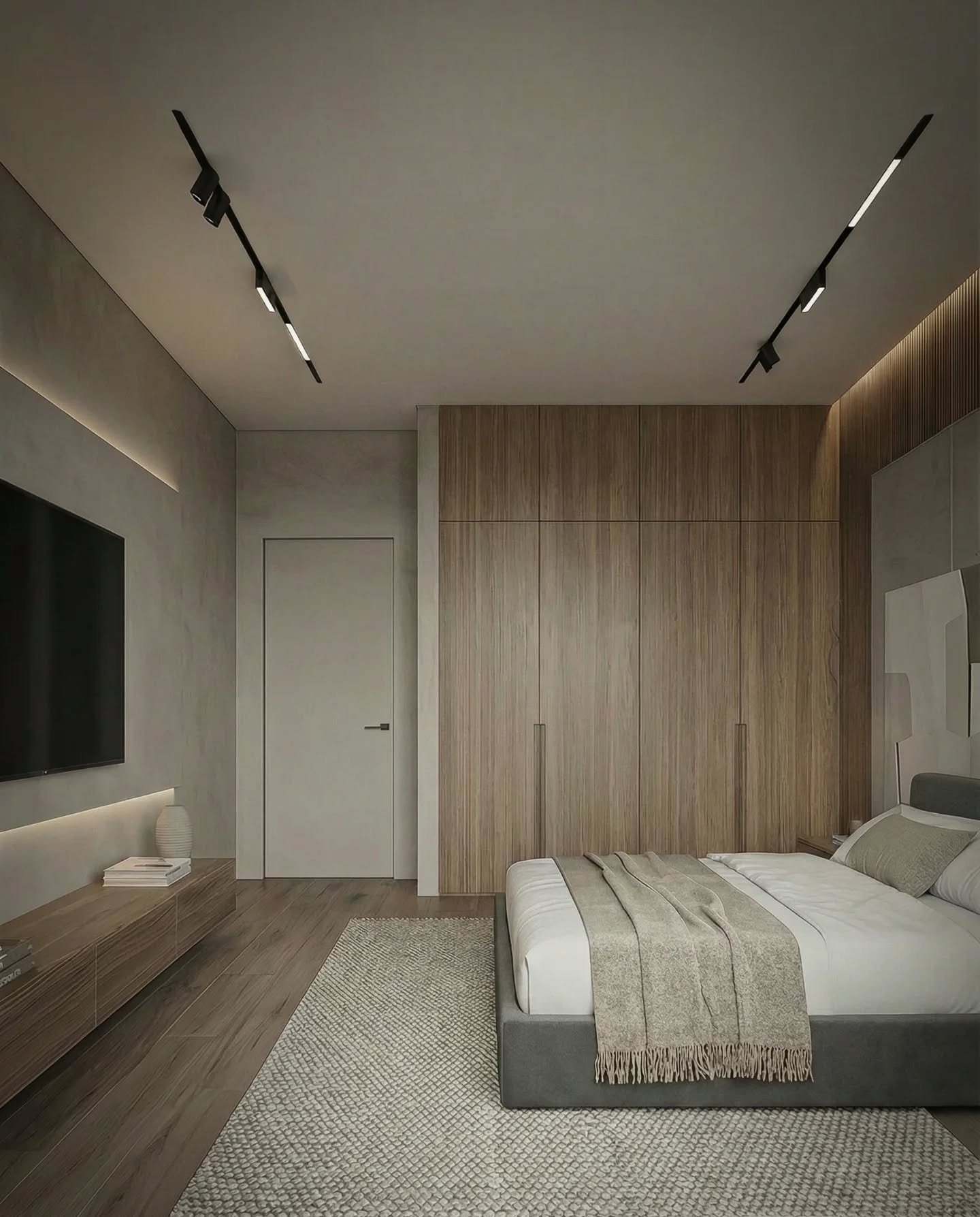 Modern grey bedroom featuring black magnetic track lights on the ceiling and a backlit TV wall panel.