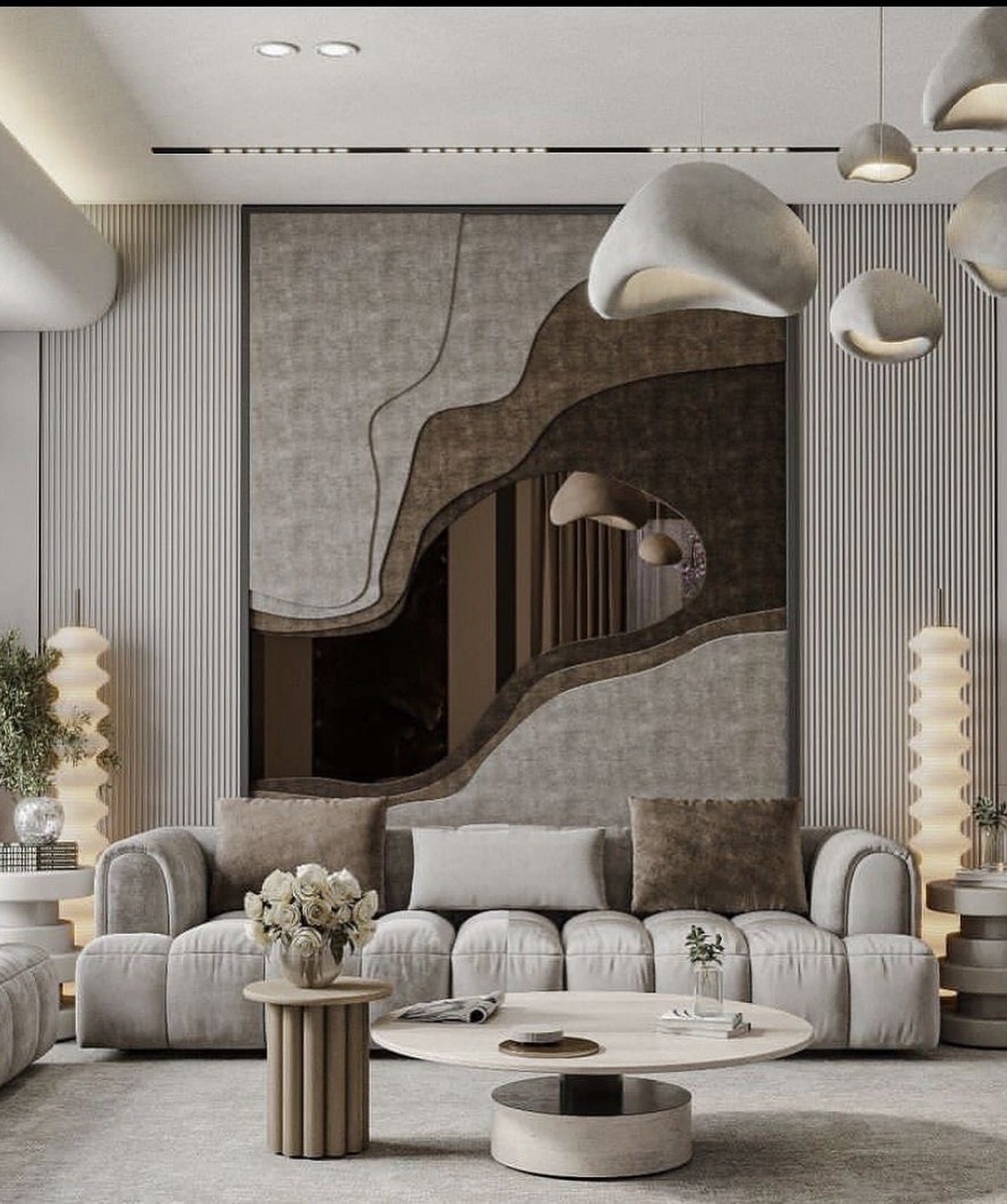 Living room wall featuring vertical fluted panels and a large central organic layered art piece with mirror accents